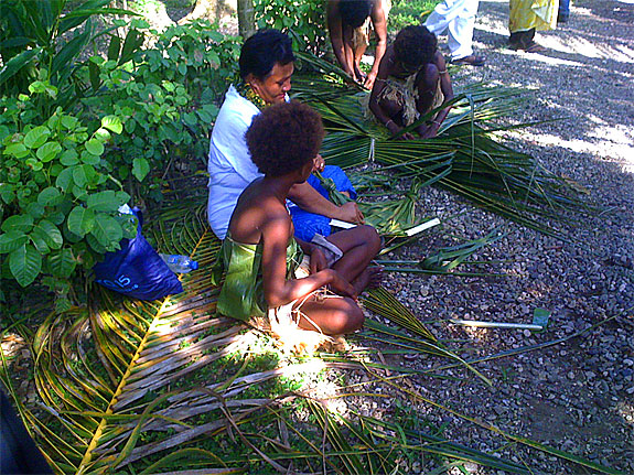 PARBICA President, Amela Silipa (Samoa), works with the village girls